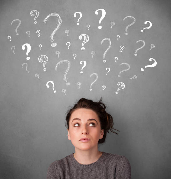 istock Young woman with question marks above her head 1175047445