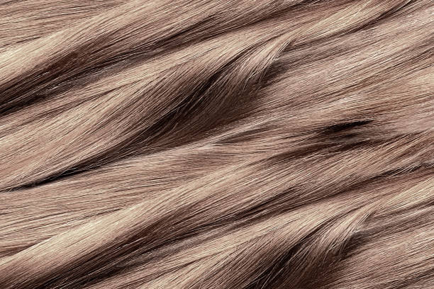 istock Curled brown hair as background, texture 1175047559