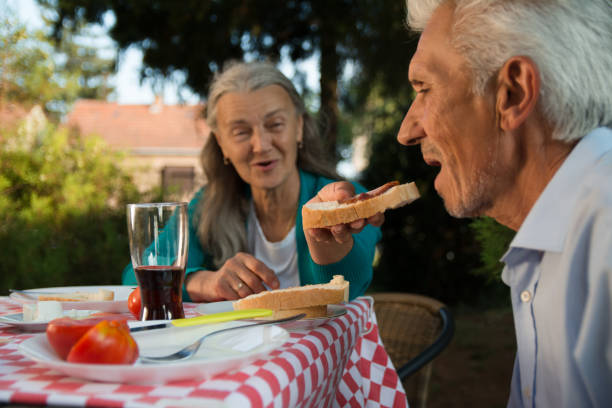 istock Senior couple heaving a great time on a picnic 1175048825