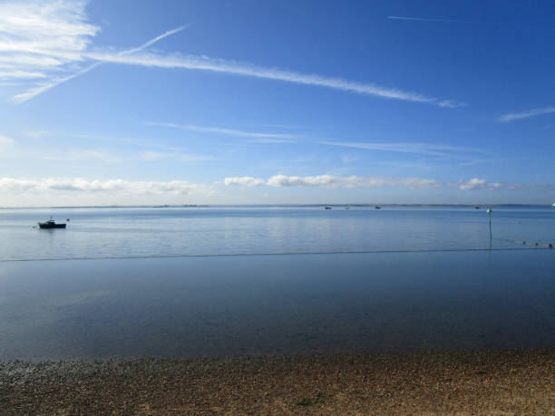 istock Calm blue water and big blue sky on a sunny day 1175050089