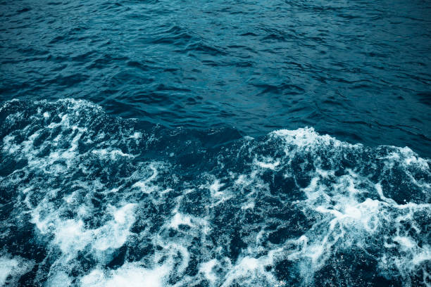 istock Sea waves and foam from a cruise ship. Water background 1175050615