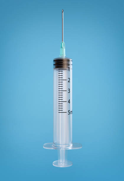 istock Empty syringe for injection isolated on blue background with clipping path. 3d render illustration 1175051084