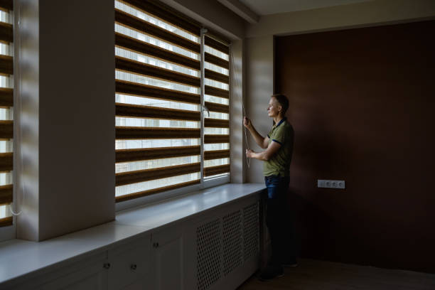 istock The man is opening  the blinds. 1175052470