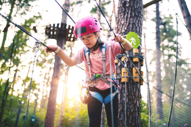 istock Girl overcomes obstacles in Adventure Rope Park 1175053111