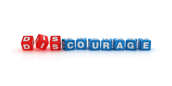 DISCOURAGE / COURAGE Buzzword Cubes - White Background - 3D Rendering