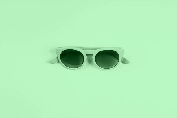 istock Mint green sun glasses. Color 2020 flat lay 1175054584