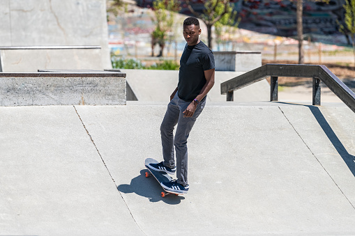 Atlanta, USA - April 20, 2018: Historic Fourth Ward outdoor skate park in Georgia downtown city with African American black man skating on ramp