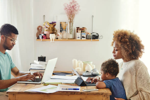 istock Parents with son using laptop and digital tablet 1175060783