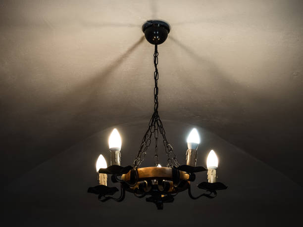 vintage chandelier shines in the dark vintage chandelier shines in the dark antler chandelier stock pictures, royalty-free photos & images