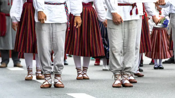 Tallinn, Estonia, 6th July, 2019: people in traditional clothing in streets of Tallinn