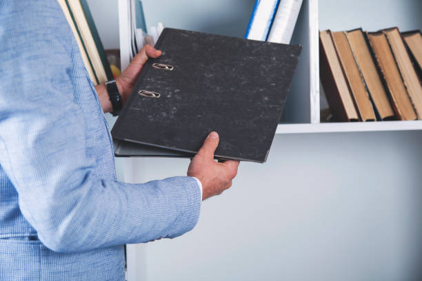 istock business man hand files 1175064428
