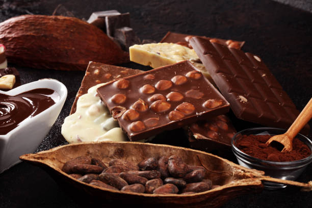 istock Melting chocolate, melted chocolate and chocolate swirl with stack and chips on table 1175064433