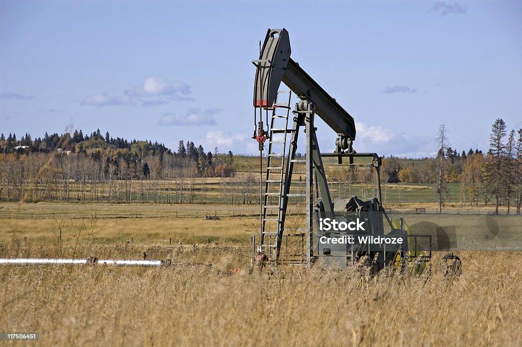 Oil pump jack in field  Alberta Stock Photo