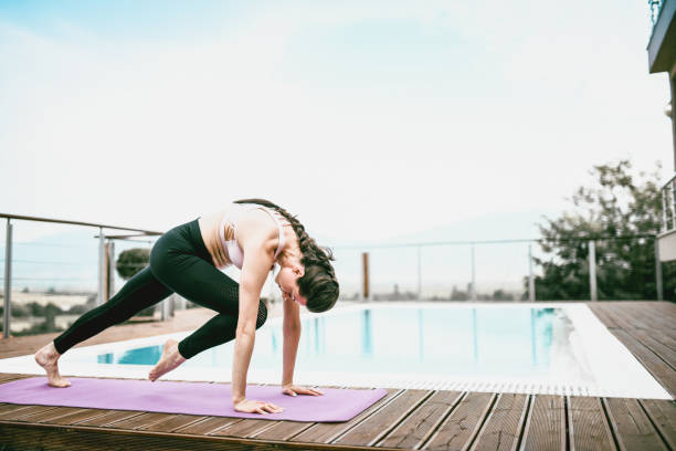 istock Beautiful Female Doing Yoga Exercises Alone 1175065370