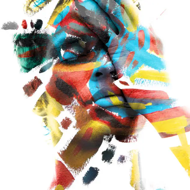 Photo of Paintography. Double exposure of an attractive male model with closed eyes and hand covering face combined with colorful hand drawn paintings