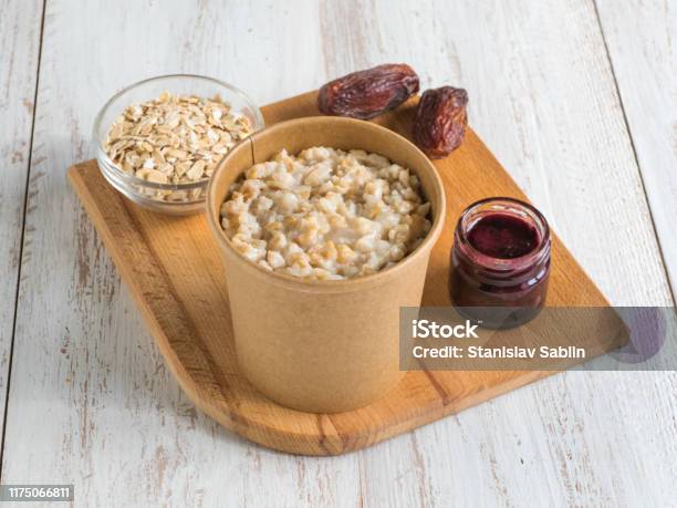 https://media.istockphoto.com/id/1175066811/photo/oatmeal-porridge-with-dates-in-a-cardboard-cup-healthy-food-and-diet-concept.jpg?s=612x612&w=is&k=20&c=b0RRP6-Y5oziRPMVuhSSWc-FAI_hMXKWV2BJPmq_0UU=