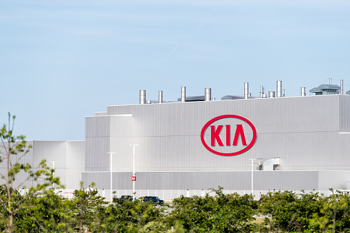 West Point, USA - April 21, 2018: Modern Kia Motors Manufacturing plant, factory, production, assembly facility in Georgia with car sign