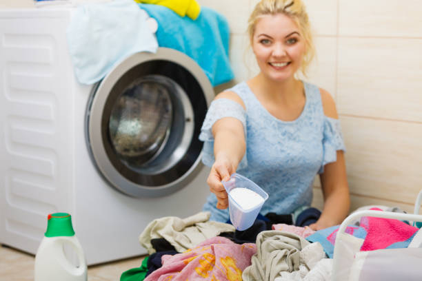 istock Woman wash laundry using powder detergent 1175069150