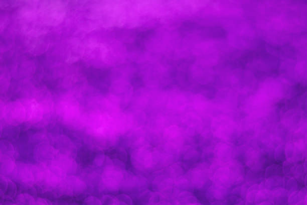 istock Glitter light abstract purple bokeh blurred background 1175070609