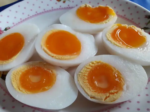 Halved boiled eggs, eaten with other Thai food