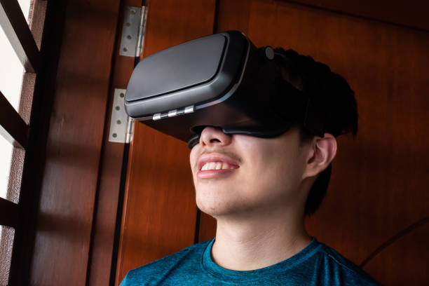 istock Teenager having fun with virtual reality simulator 1175071604