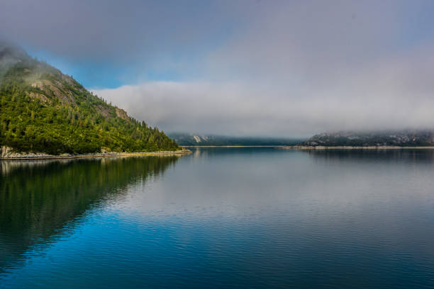 istock Remote Alaska coastline, on a calm, misty morning in the Inside Passage 1175073542