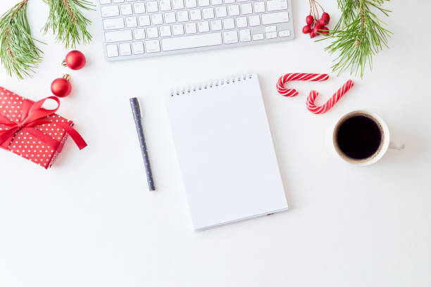istock Mockup white notebook with pine branches and keyboard, christmas decorations  on a white background 1175074364
