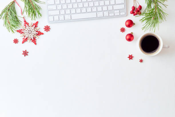 istock Flat lay christmas home office desk with pine branches and keyboard, christmas decorations  on a white background 1175074368