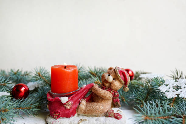 christmas bear candle with tree pine and new year decoration, copy space