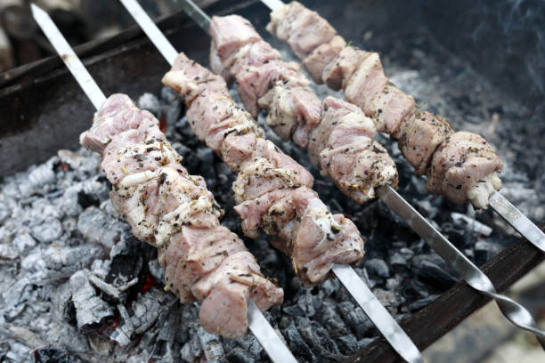 istock Roasting meat on skewers 1175074902