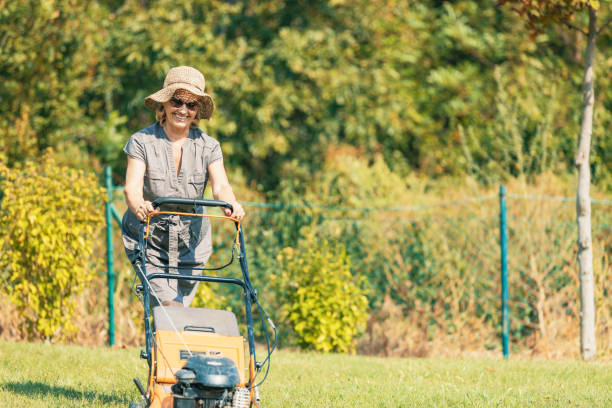 istock Senior woman mowing grass 1175075515