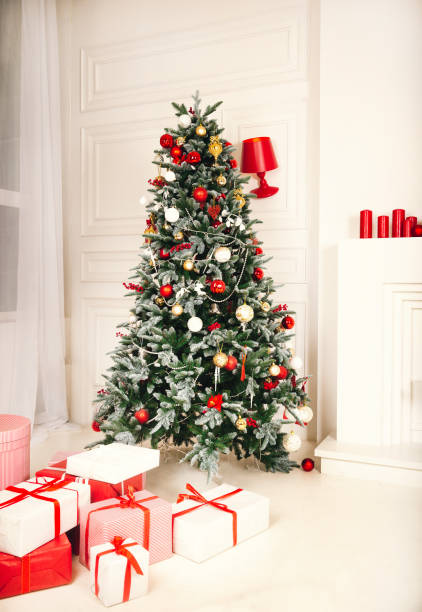 istock Christmas tree, gifts, red, balls, white  room, 1175075837