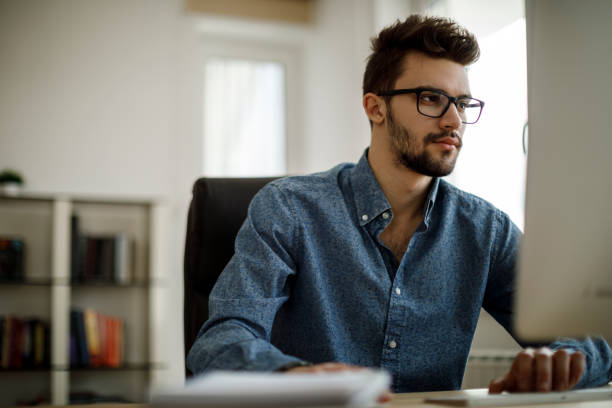 istock Young man working in the office 1175076892