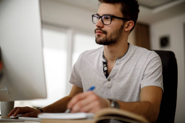 istock Young man working at home 1175076999