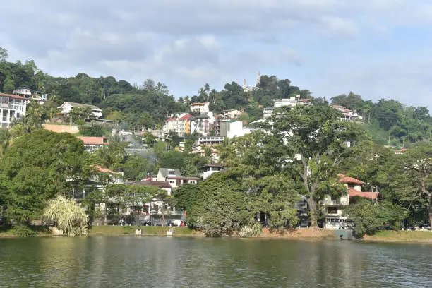 Photo of Scenic view of Kandy city in Sri lanka.Kandy is surrounded by mountains.The city's heart is scenic Kandy Lake (Bogambara Lake) and Temple of the Tooth (Sri Dalada Maligawa)