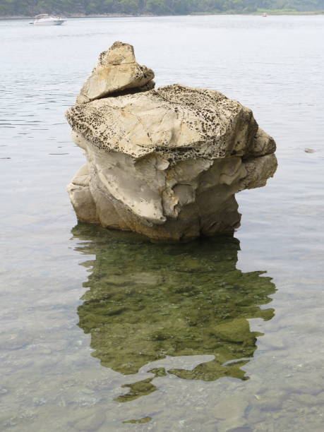 istock big rock in the sea, Rab 1175078445