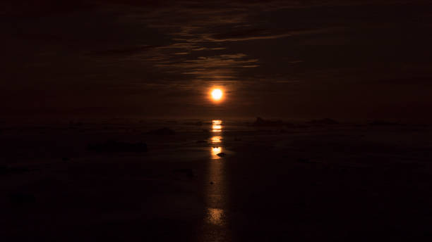 istock Sun light reflection on the Arctic Ocean in Greenland 1175079333