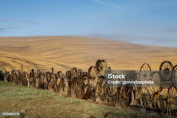 Fence Made Of Old Wheel And Gears On The Palouse Stock Photo - Download Image Now - Fence, Wagon Wheel, Washington State