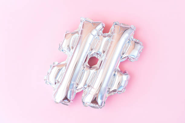 istock Silver inflatable hashtag sign on a pink background. Minimalistic flat lay. 1175081182
