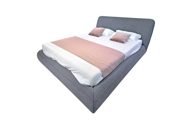 istock Double bed with linen isolated on white. Three-quarters perspective. 1175081358