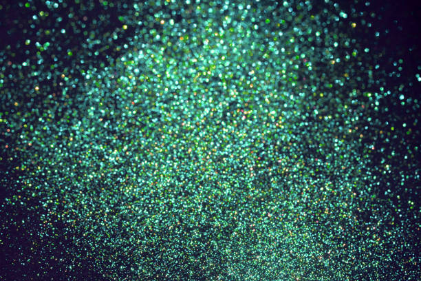 istock Green bokeh blurred sparkling glittering background 1175081950