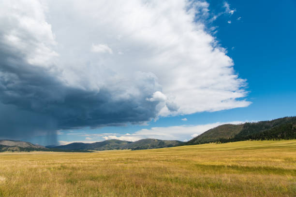 Storm cloud and rain storm over Valles Caldera National Preserve in northern New Mexico