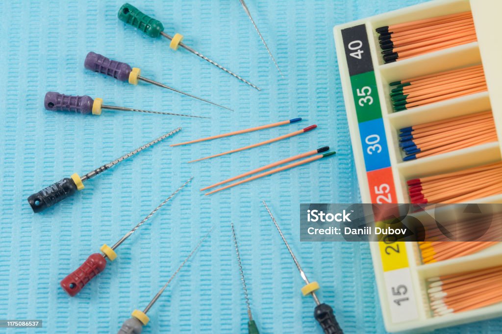 gutta-percha pins gutta-percha pins in a set of different sizes for root canal filling, endodontic ruler close-up, material for endodontic filling Dental Equipment Stock Photo