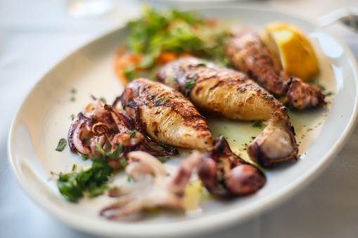 Grilled squid meal in a seafood restaurant.