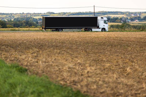 istock plain truck near a field 1175088095