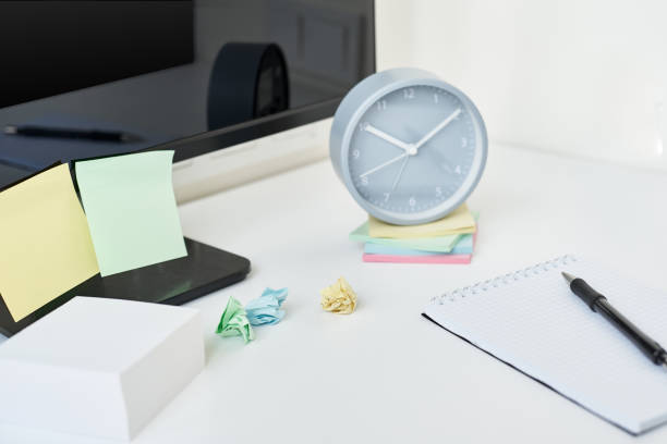 istock Modern workspace background. Workplace with a clock, office supplies and sticky notes 1175090504