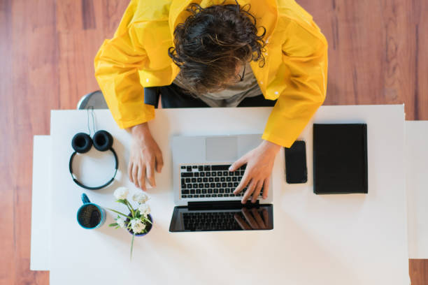 istock Young men working in office with raincoat 1175092289