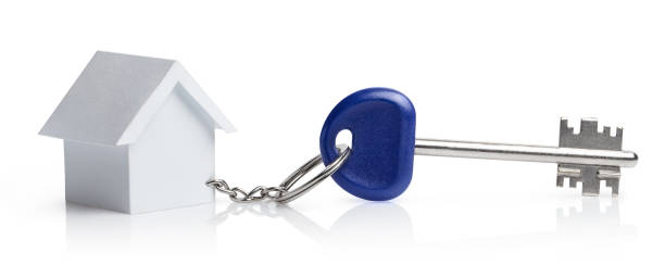 istock House keys with a toy house on white 1175092896