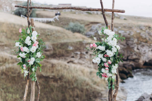 istock Fragment of a wedding arch for an exit ceremony decorated with flowers. 1175093041
