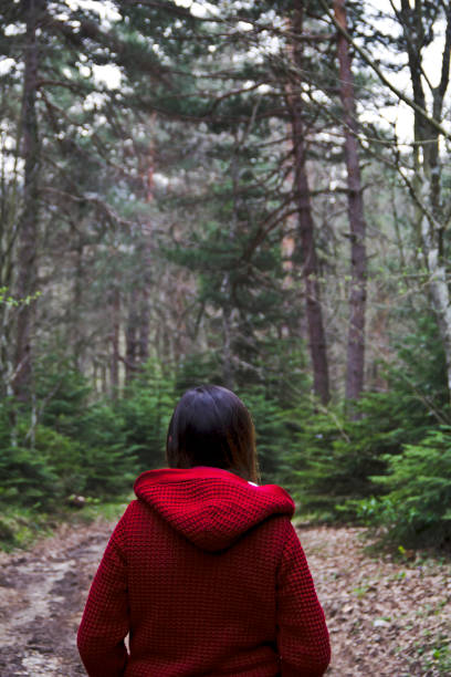 istock Woman in Red in Forest Alone 1175095727